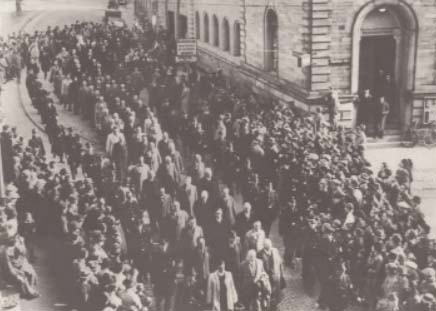 Jews being marched away to detention after Kristallnacht